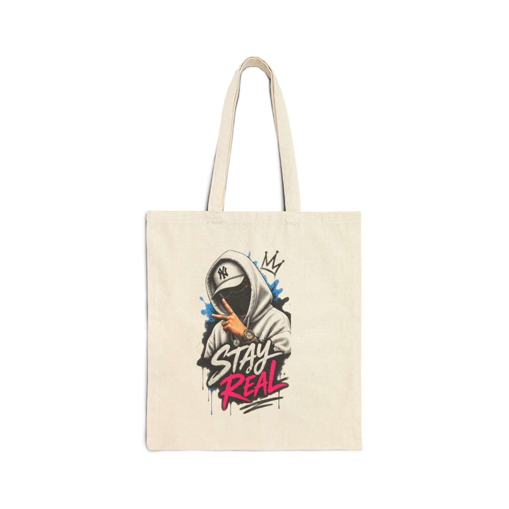 Durable cotton canvas tote bag with graphic design saying "STAY REAL" in vibrant colors.
