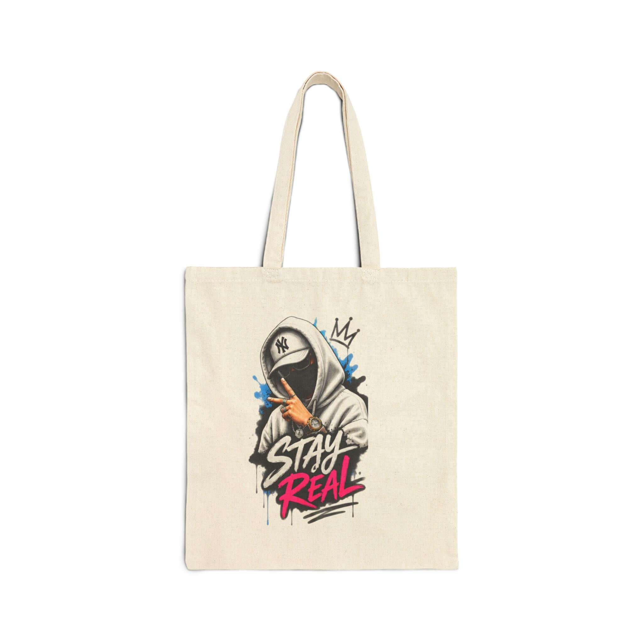 Durable cotton canvas tote bag with graphic design saying "STAY REAL" in vibrant colors.