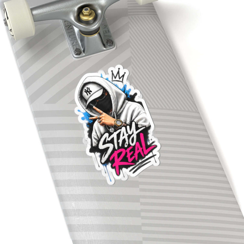Custom kiss-cut stickers design featuring a cool character and the phrase 'STAY REAL' on a skateboard.