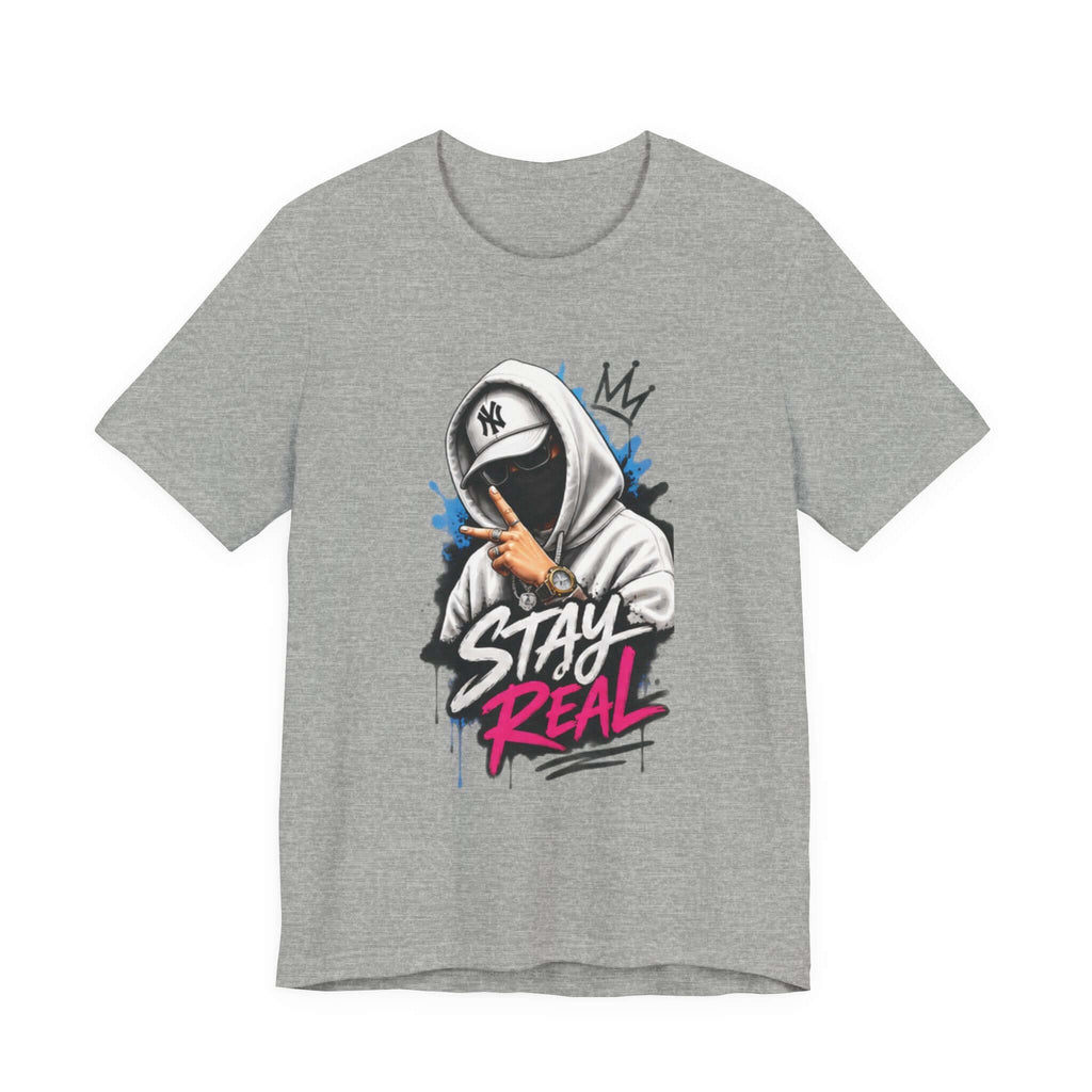 Unisex short sleeve tee featuring a graphic design with the text 'Stay Real' in bold colors.