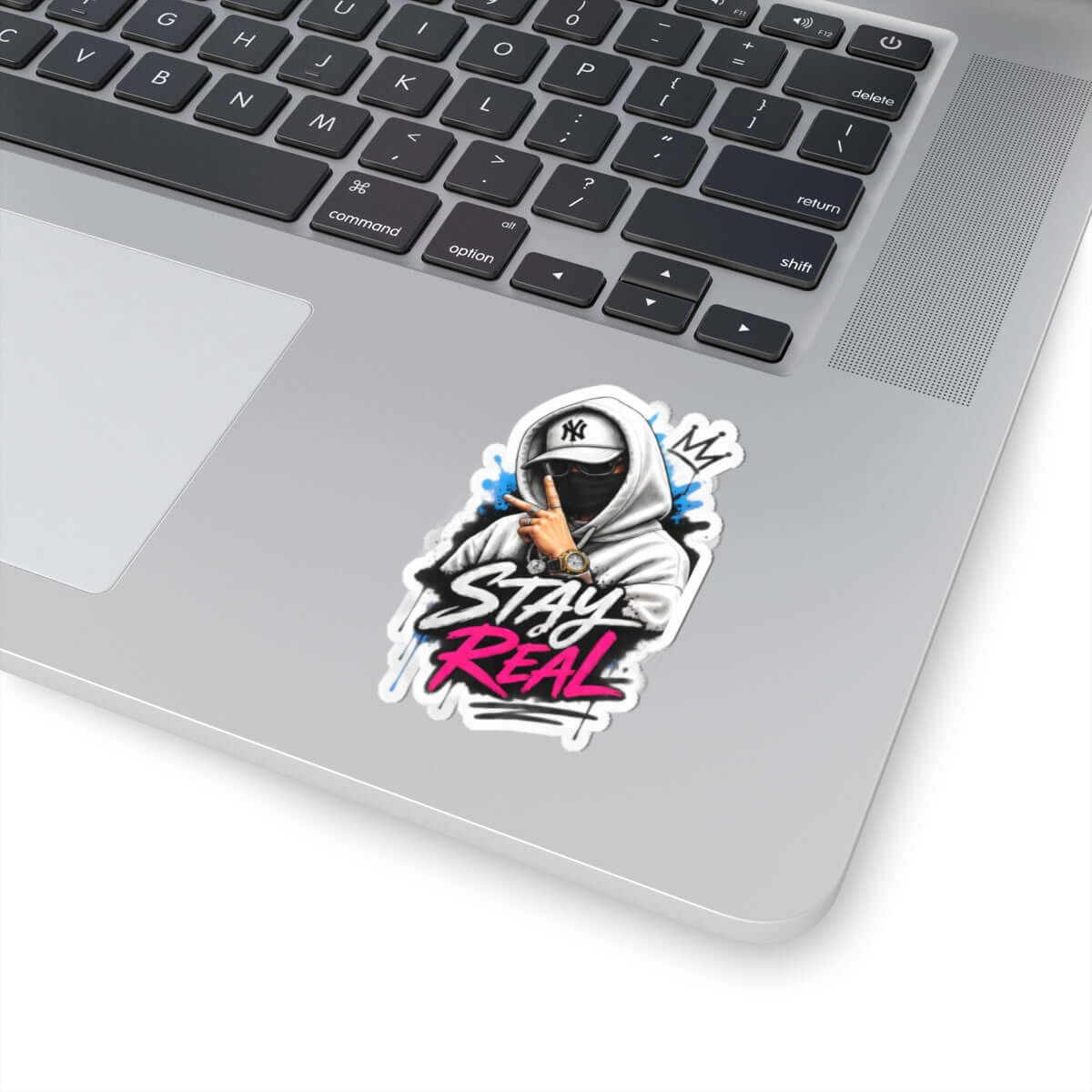 Custom kiss-cut stickers featuring a cool design on a laptop, emphasizing the phrase 'Stay Real'.