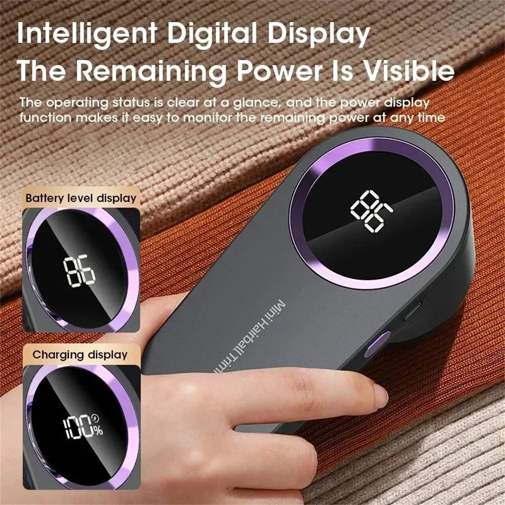 Portable lint remover with intelligent digital display showing battery level and charging status on a fabric background.
